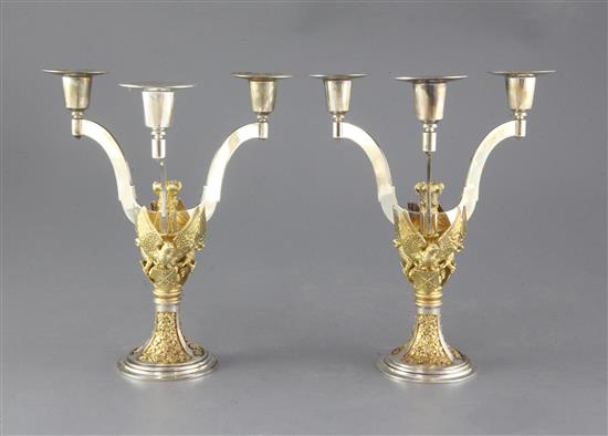 A pair of 1980 parcel gilt silver St. Pauls Cathedral Wedding candelabra